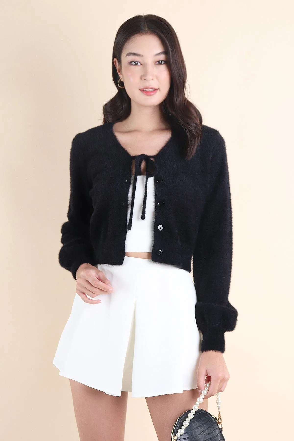 ELIZ BOW FURRY CARDIGAN IN BLACK